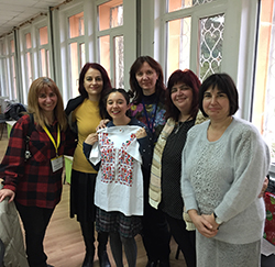  "I pose with five of my school's English teachers to present the Christmas gift they got me."