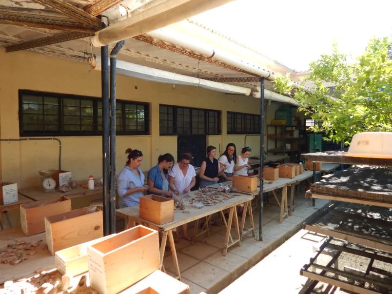 Faculty and Students with Pottery