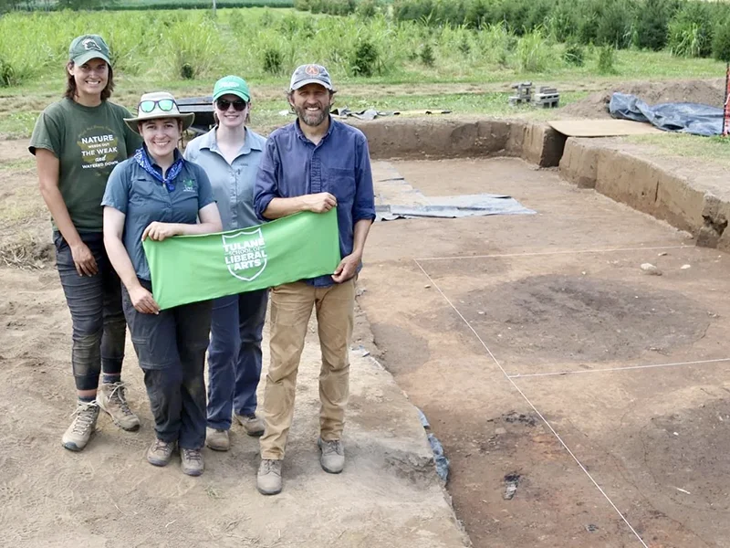 grad students researching at dig site