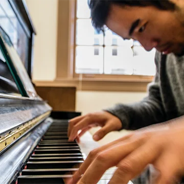 Man playing piano, Tulane University