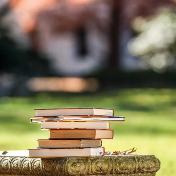 Books on a concrete bench outside