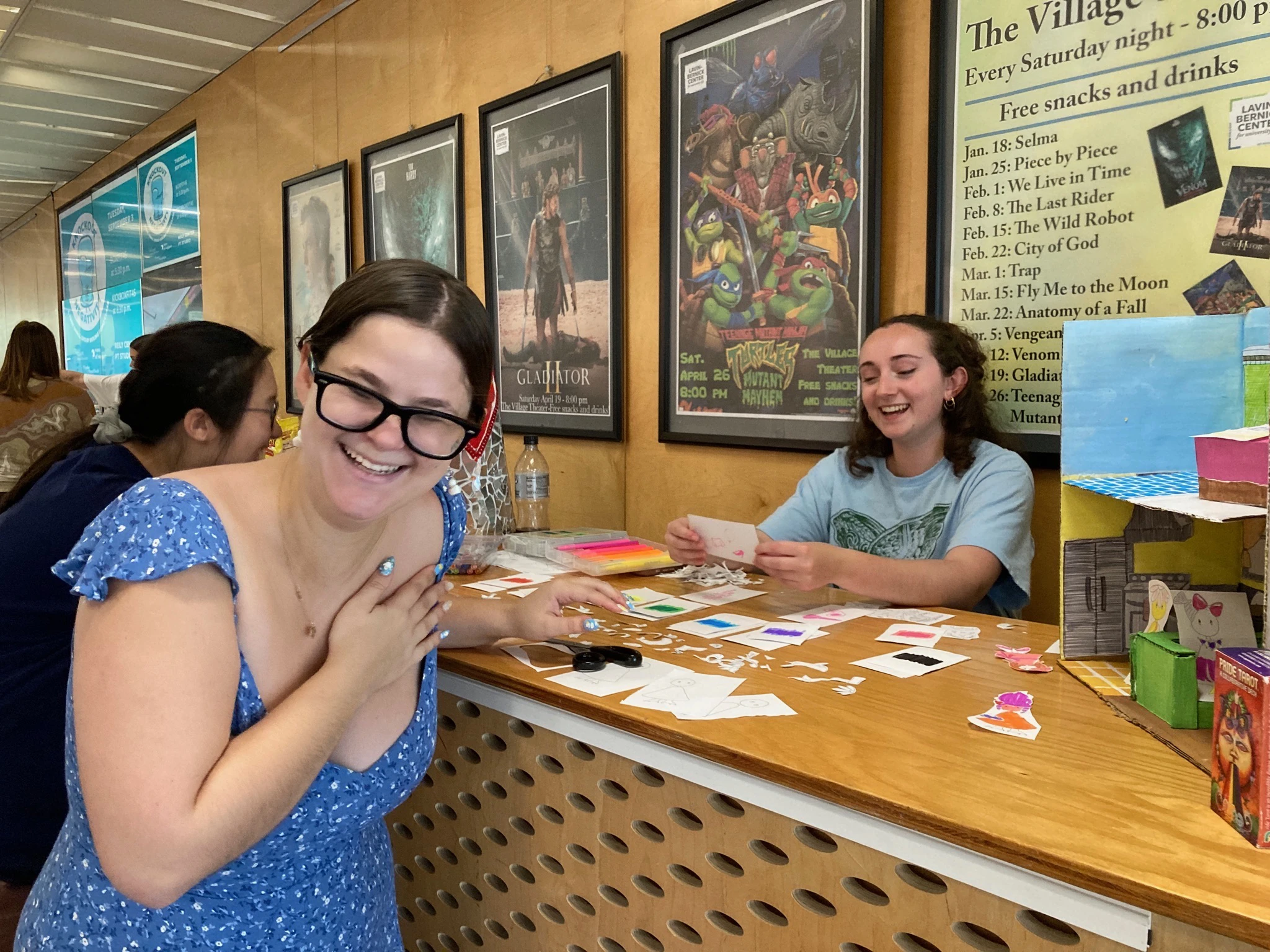 Tulane Students at a booth laughing