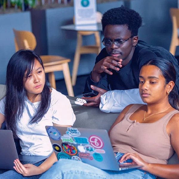 Students around a laptop