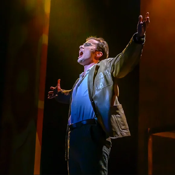 Performer on stage singing