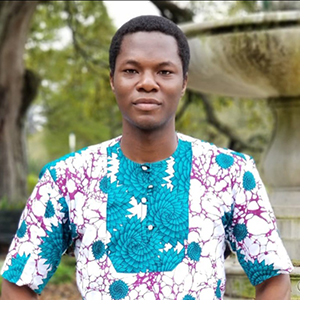 Man wearing colorful shirt standing outside
