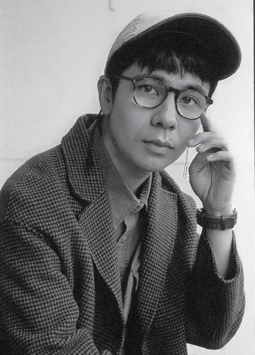 Black-and-white portrait of author Ocean Vuong. photo Gioncarlo Valentine