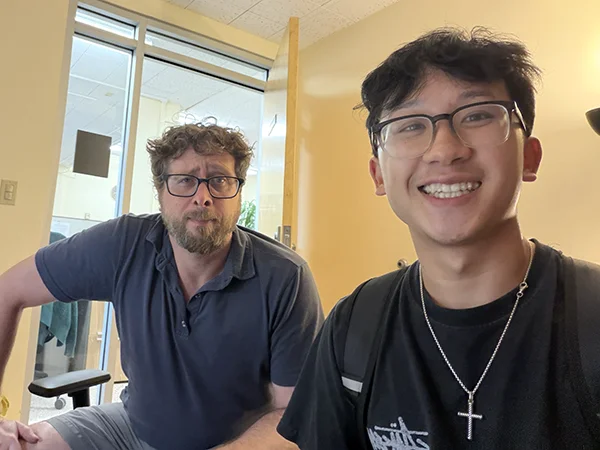Austin Vu and Professor Daniel Burnston meeting for a Tenenbaum Tutorials project, Tulane University