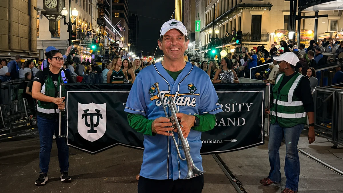 Dean Brian Edwards with the Tulane Marching Band at Mardi Gras