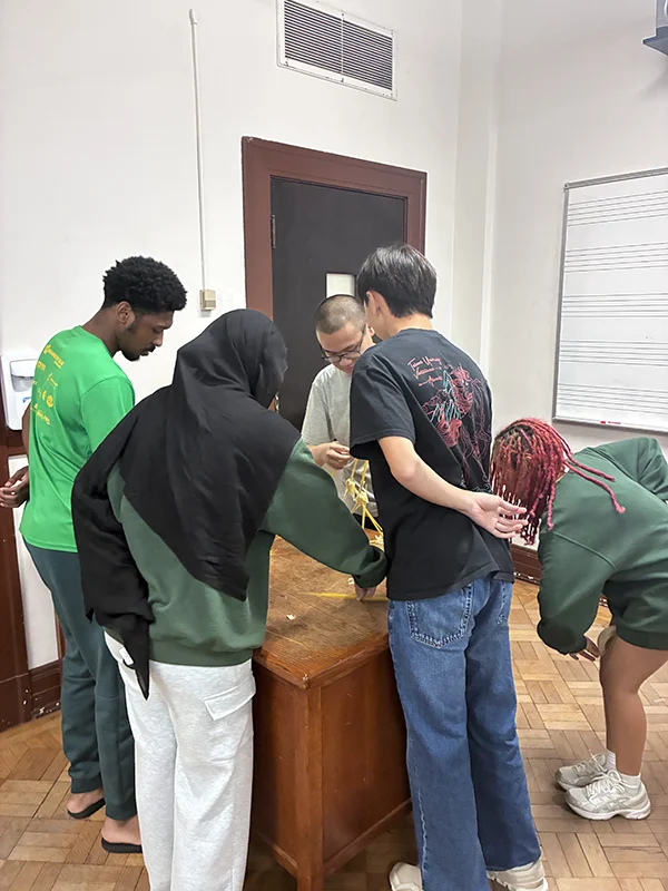 Tulane's Posse Scholars group in a leadership competition building the tallest building with noodles