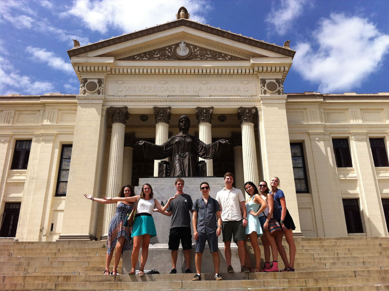 Tulane Cuba Semester Abroad students pose on the steps of the University of Havana