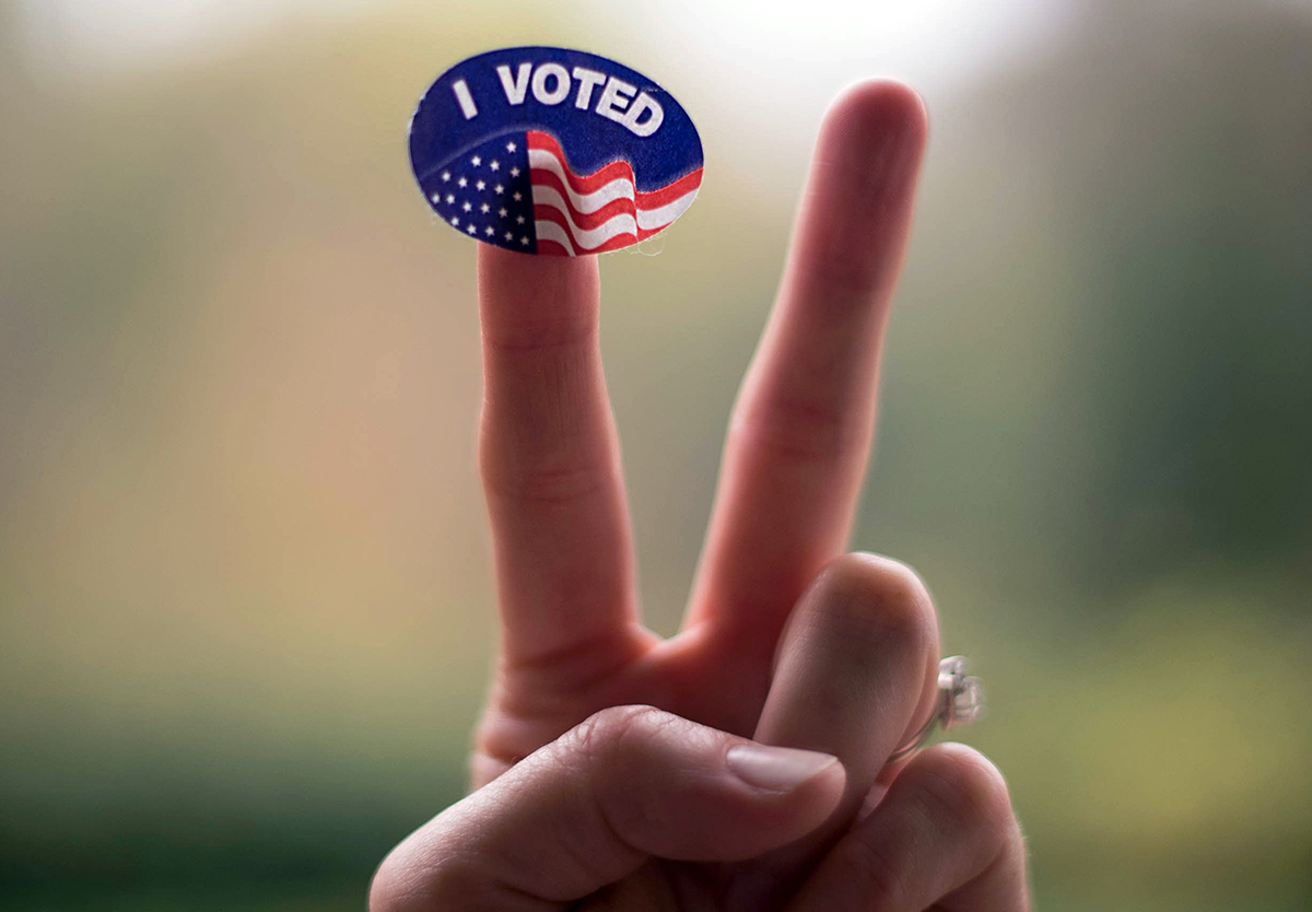 I voted sticker on finger of peace sign. 