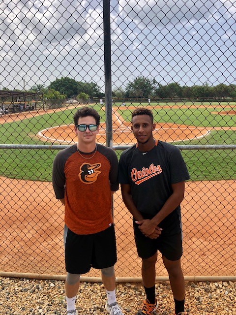 Alumnus Elliott Michalson (SLA '19) with Baltimore Orioles pitcher José Rodríguez