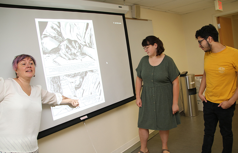  Professor Megwen Loveless with students in language class