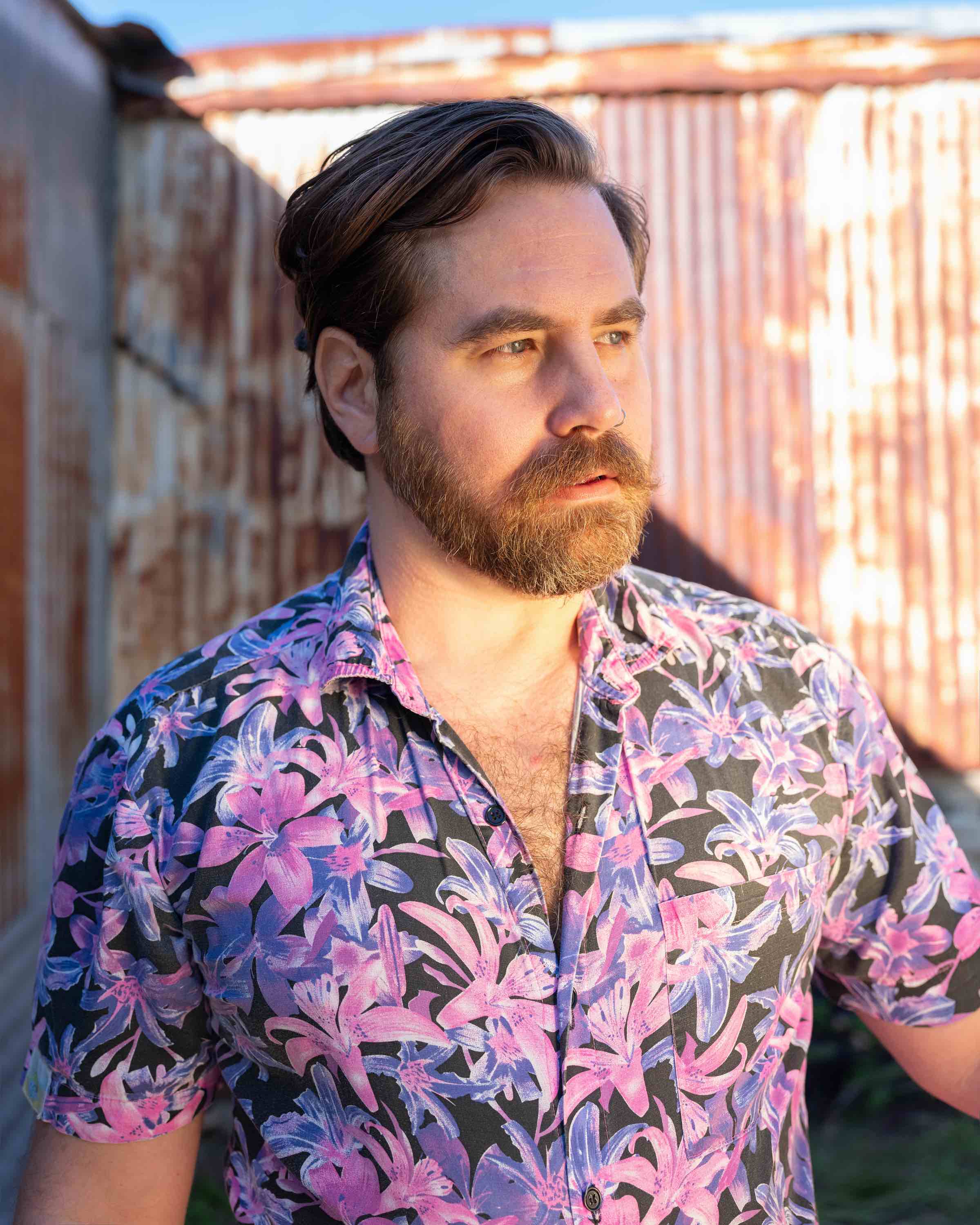 Portrait of Sean Fader in a tropical print shirt 