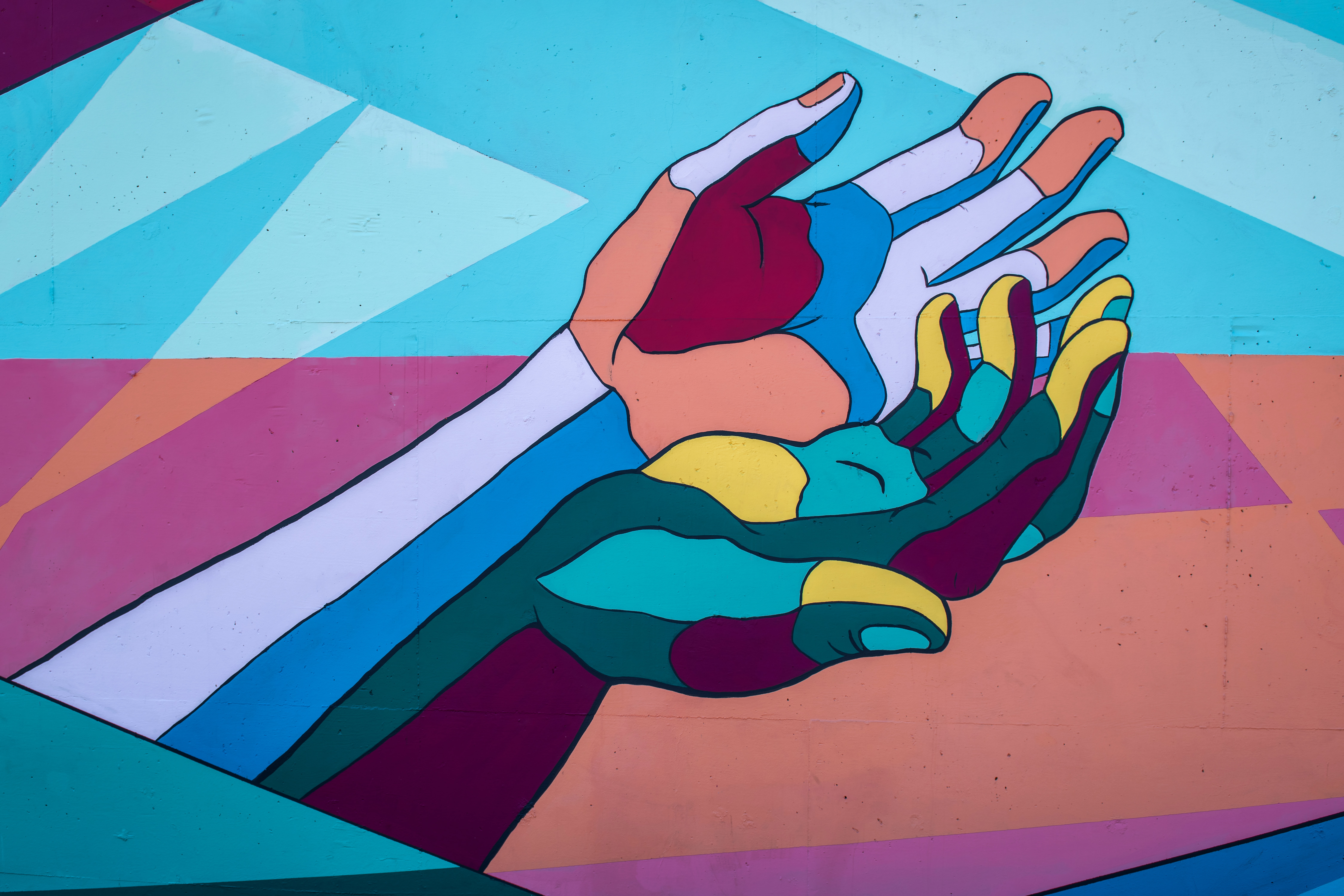 Illustration of open hands. Image: Tim Mossholder on Unsplash