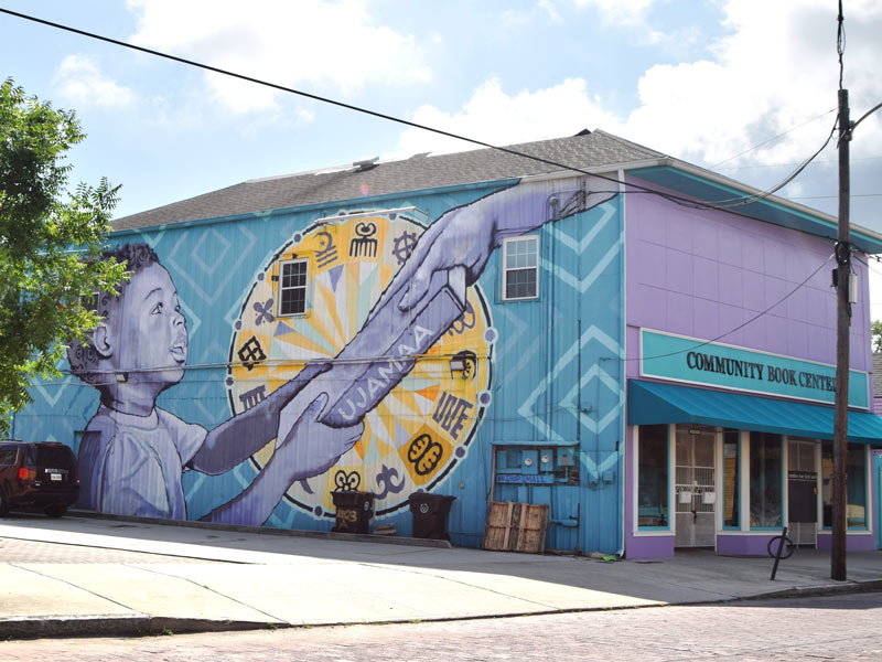 Mural by Brandon “BMike” Odums on the Community Book Center, Bayou Road