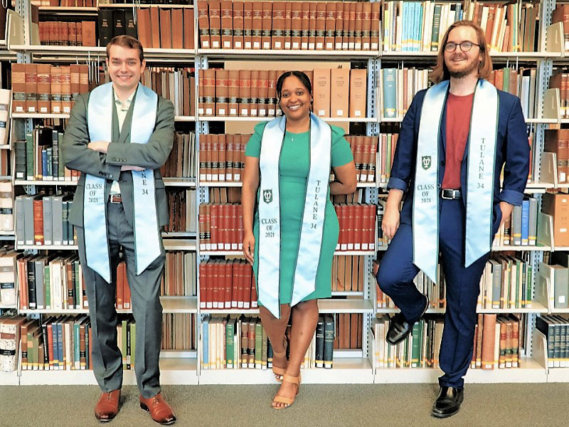 Jayde Encalade, Jacob McCarty and Brandon Sprague, all graduating third-year law students