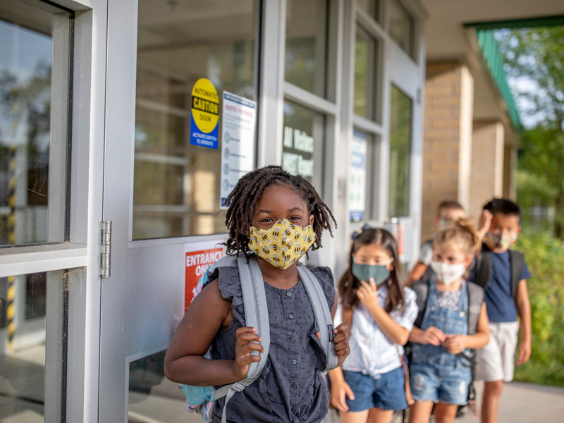 School kids wearing protective masks
