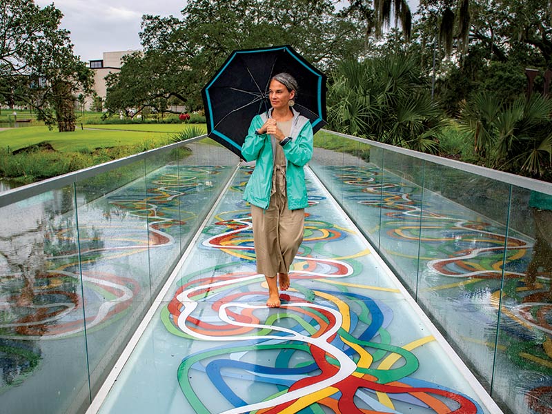 Rebecca Snedeker walking along Elyn Zimmerman’s installation Mississippi Meanders, in City Park