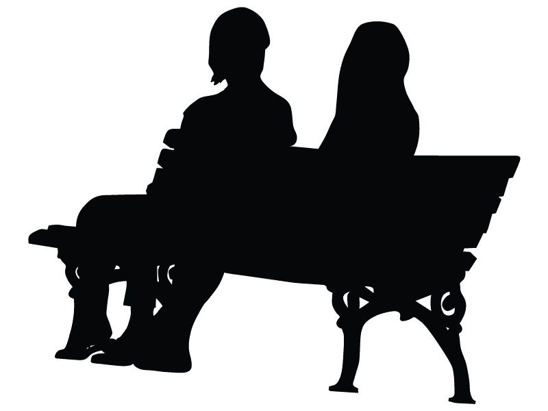 silhouette of two people on bench
