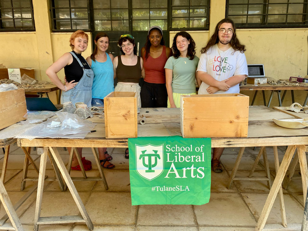 Students taking a break from fieldwork to show some Tulane School of Liberal Arts pride