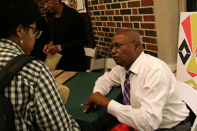 Leon Waters speaking with attendees at Tulane University