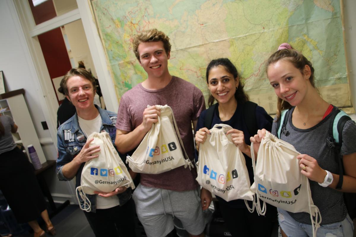 Students show off their GermanyinUSA swag bags at the Integrating Immigrants exhibit