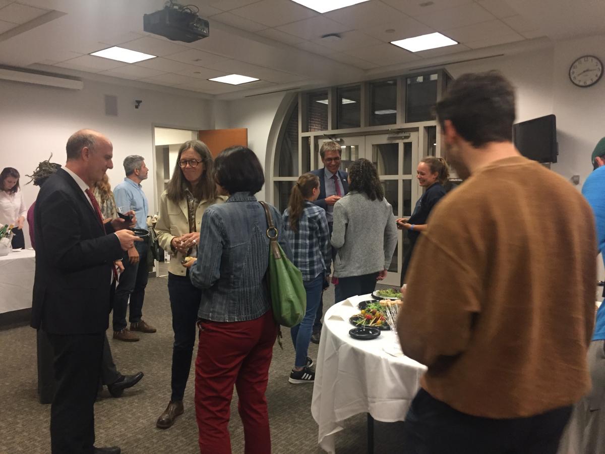 Professors and students partake in discussion at a lecture event