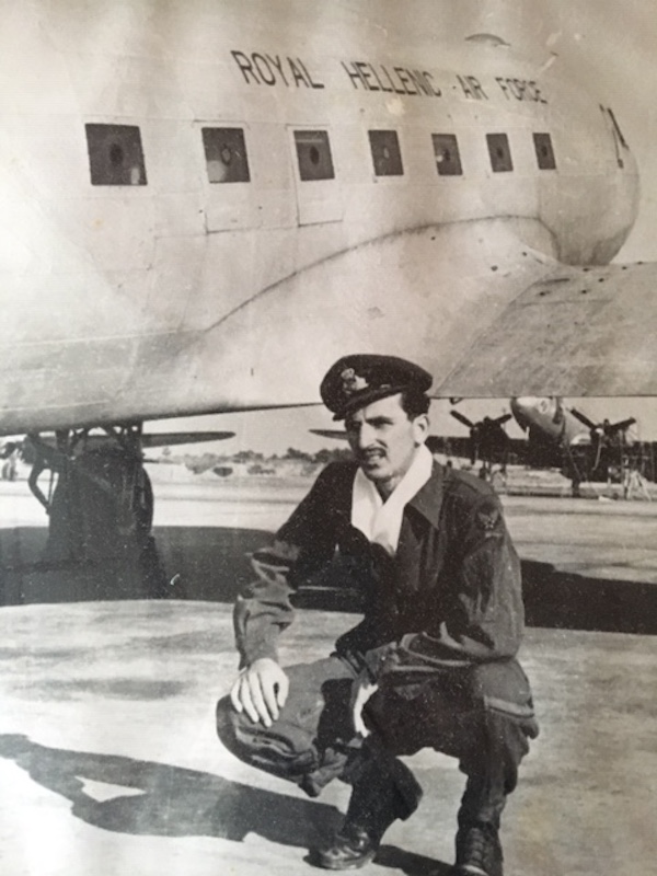 Dennis A Georges posing in front of a Royal Hellenic Air Force plane