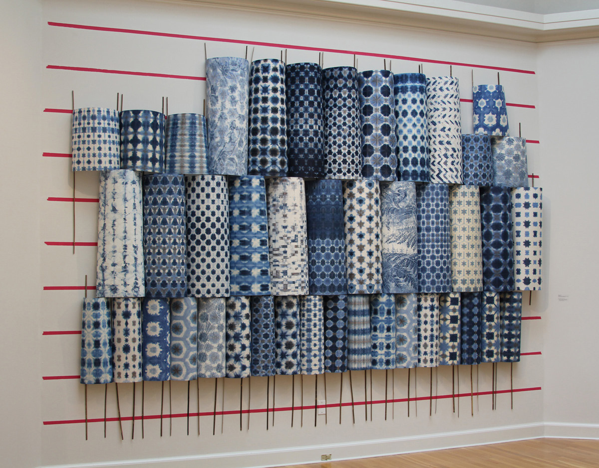 Wall Relief, Seep. Sheets of Japanese paper folded, dyed, and attached to bamboo sticks. Teresa Cole