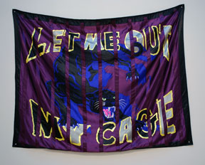 fabric banner of panther and text that reads "let me out of my cage"