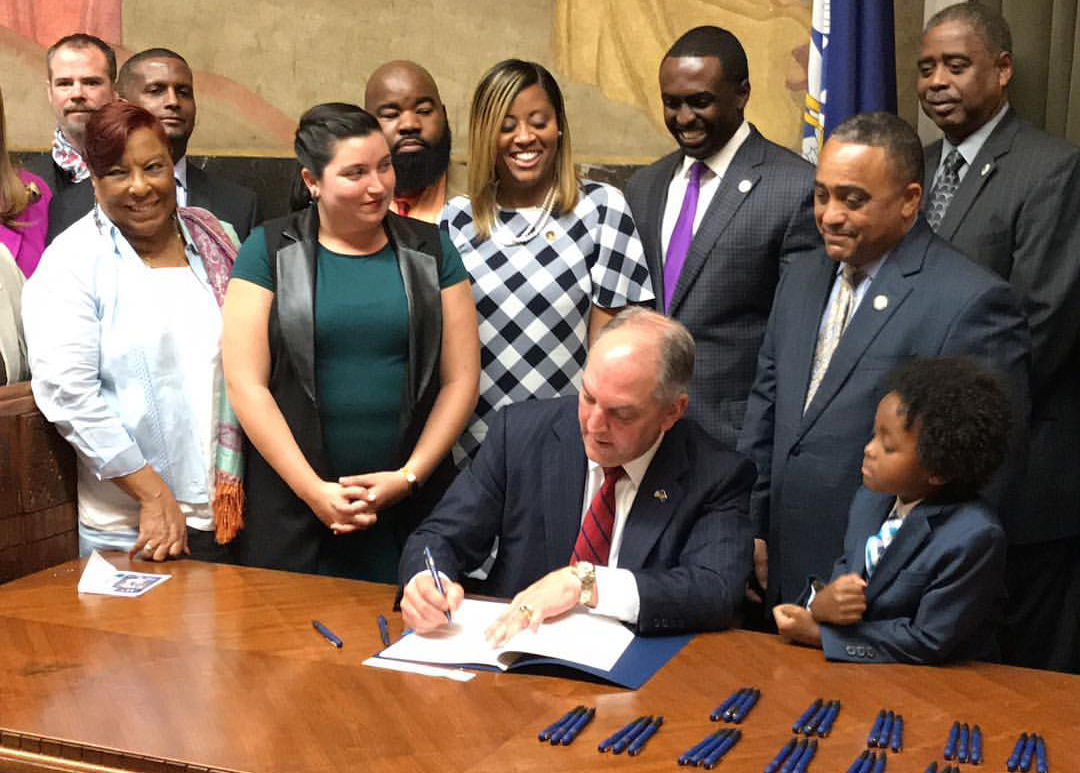 Annie Phoenix, Syrita Steib and others with Louisiana Governor John Bel Edwards
