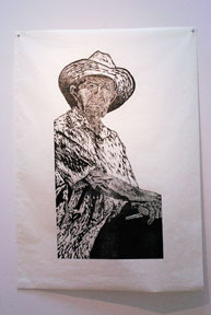 woodcut printed on paper, image of man with cowboy hat