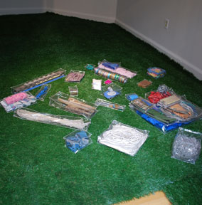 floor view with artificial grass and plastic packages