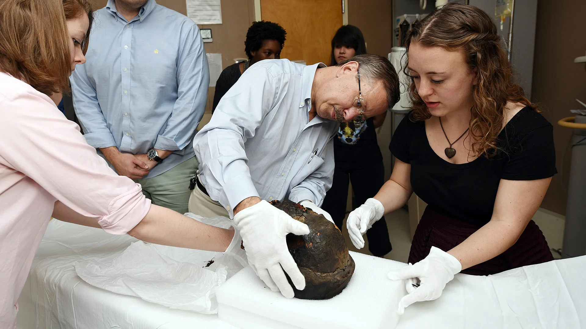 Rachel Witt, Bruce Bordlee, John Verano and Savannah Bailey perform CT scan on a male Egyptian mummy