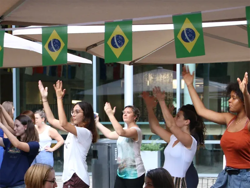 Megwen Loveless (middle) and students at the “PORtrait of Brazil” event