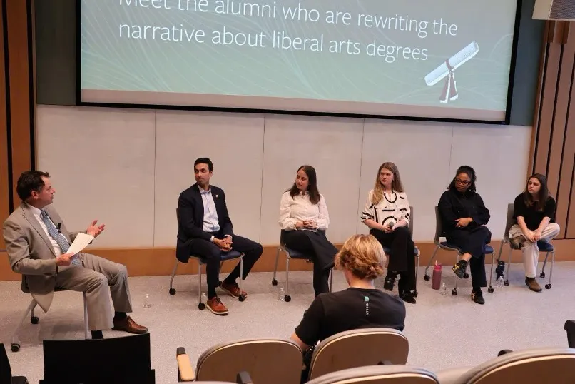 2026 Young Alumni Perspectives Panel moderated by Dean Edwards in Lake Village Theater.