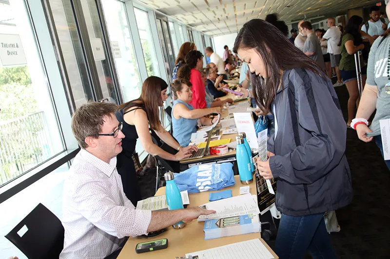 SLAMs new program director Ryder Thornton, speaks with a prospective student