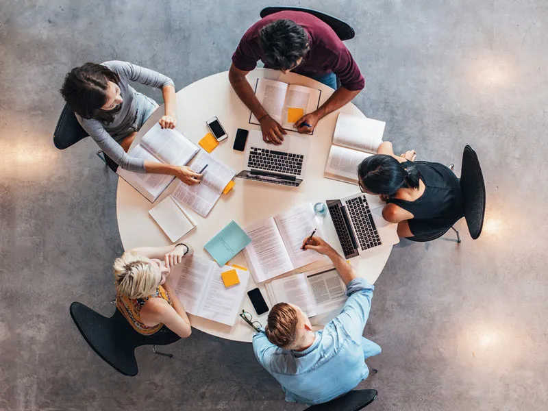 People working at a round table together