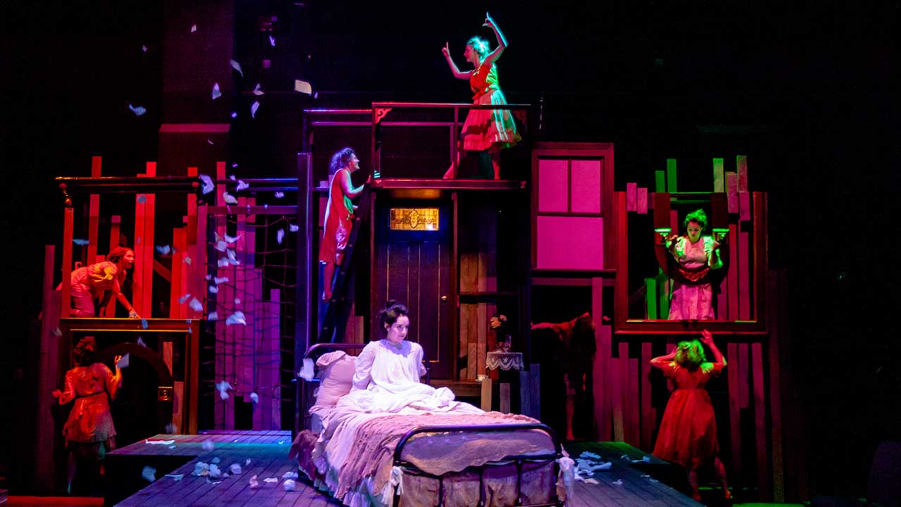 Students of Tulane University Theatre and Dance perform a play.